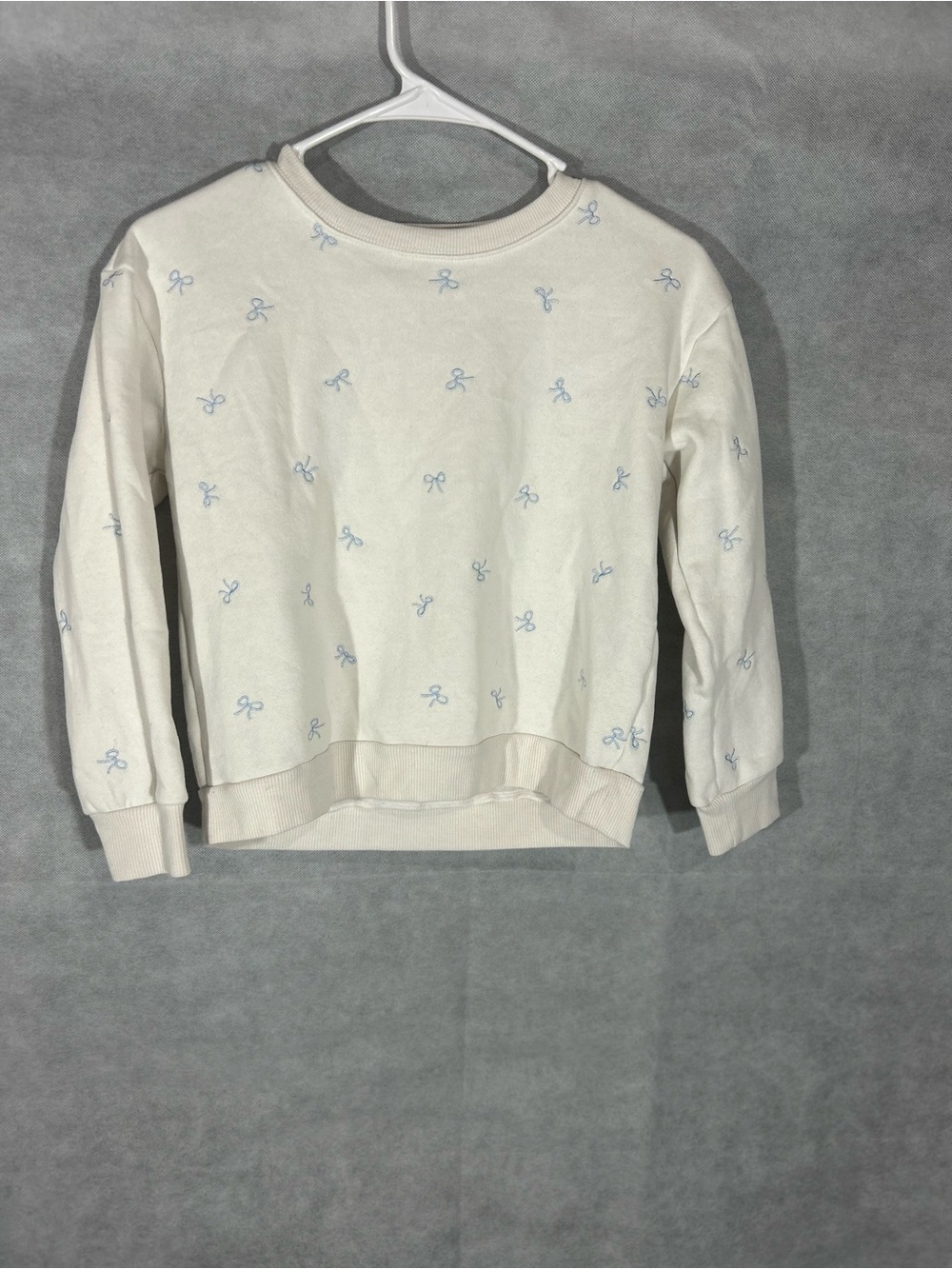 Kids Cream Crewneck Sweater with Light Blue Bow Print